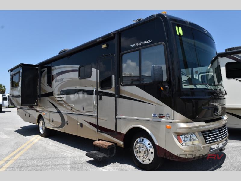 Side view of a used 2014 Fleetwood RV Bounder 35K