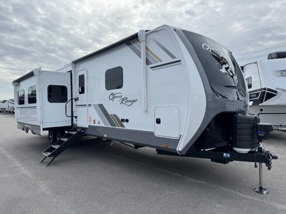 Exterior door side view of new 2026 Open Range 338BHS with dual power awnings