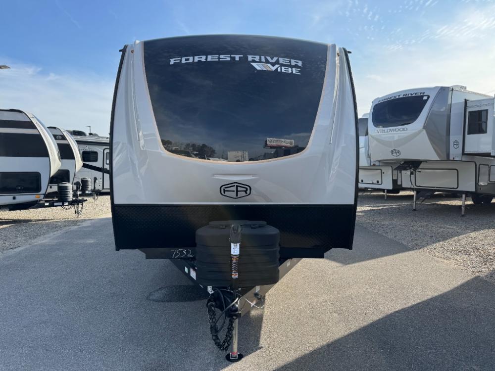 Front profile of 2026 Forest River Vibe 2600RK with gloss fiberglass exterior and fiberglass front cap