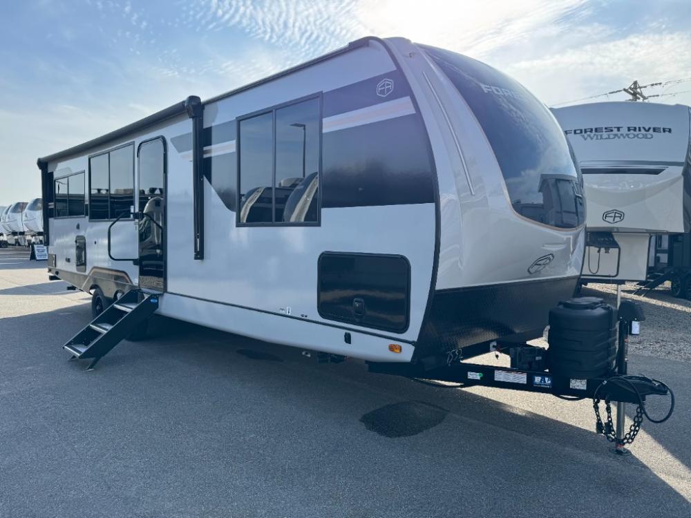 Front profile of 2026 Forest River Vibe 2600RK with gloss fiberglass exterior and fiberglass front cap