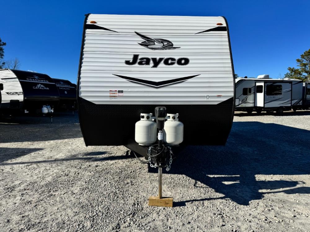 Exterior side view of Used 2022 Jayco Jay Flight SLX 8 265RLS travel trailer with power awning extended at Recreation USA
