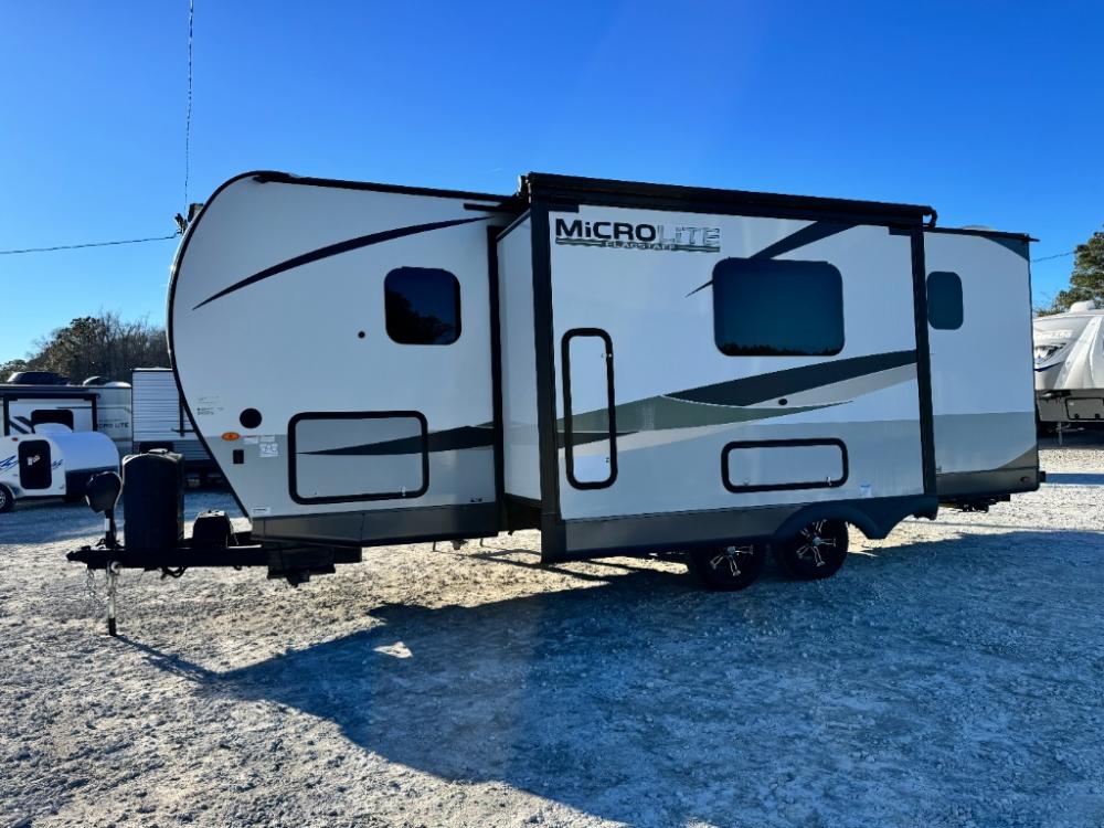 Used 2023 Forest River Flagstaff Micro Lite 25BRDS travel trailer exterior with awning at Recreation USA in Longs SC