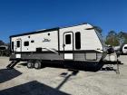 Exterior side view of Used 2022 Jayco Jay Flight SLX 8 265RLS travel trailer with power awning extended at Recreation USA