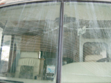 RV windshield damage before replacement.