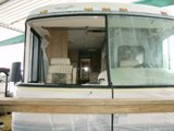 RV windshield damage before replacement.