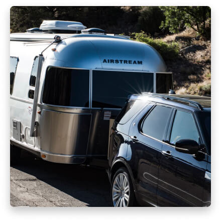 Airstream being towed by a car