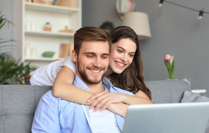 Couple looking on computer