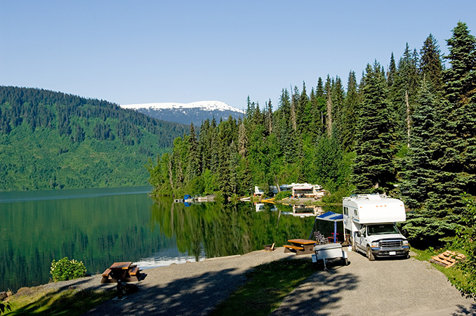 RV Camping in the wood beside a lake