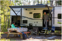 couple sitting inside their RV