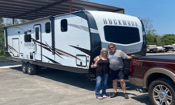 happy campers with rockwood travel trailer