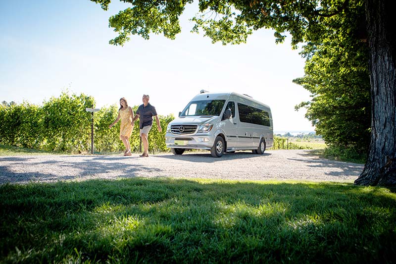Couple with Interstate Lounge EXT Touring Coach