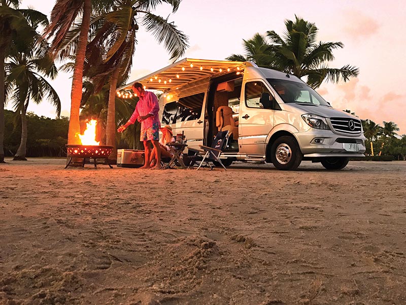 Couple Beach Camping with Tommy Bahama Interstate Touring Coach