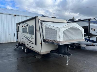 Camp side front of used hybrid trailer for sale.