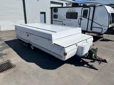 Passenger side of used tent trailer when closed.