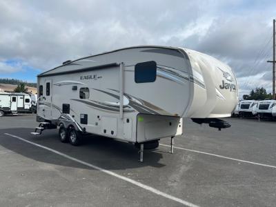 Camp side exterior view of this used fifth wheel.