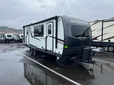 Camp side view of this luxury trailer.